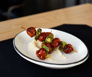 Mini pork chorizo and shishito skewered, garlic mashed potatoes