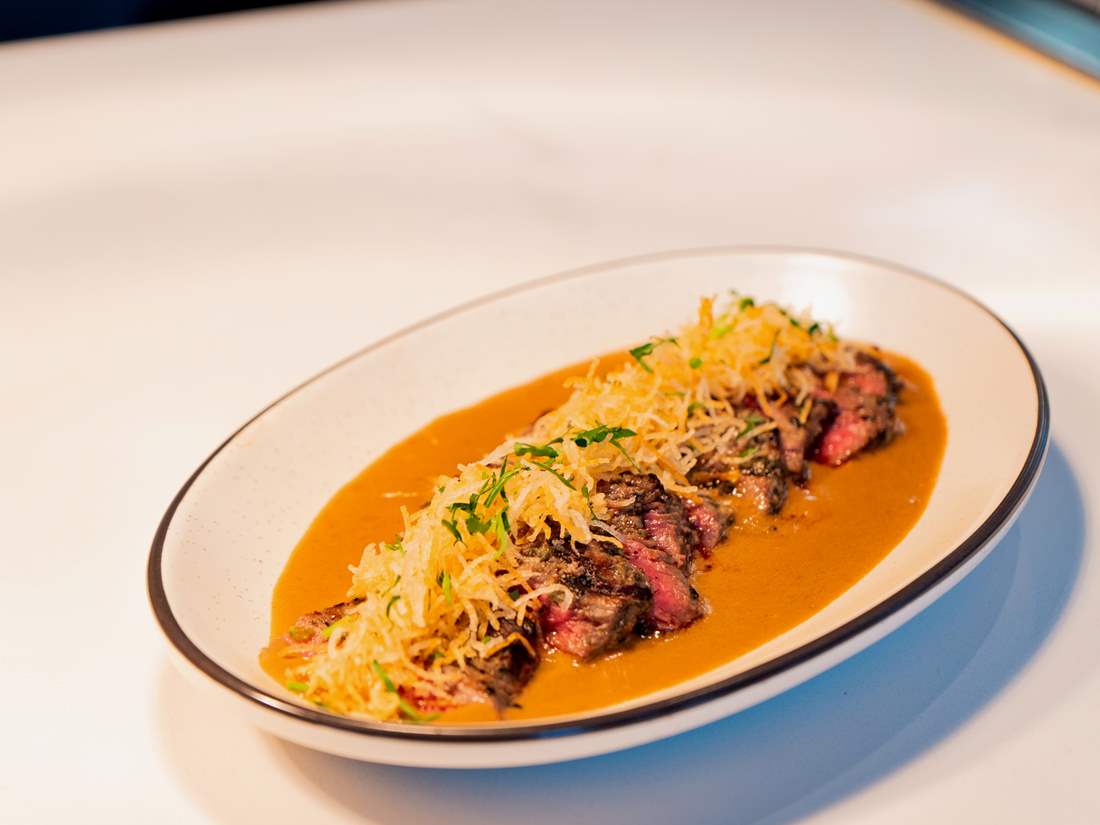 Grilled Steak with cabrales blue cheese sauce, crispy potato strings