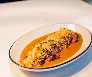Grilled Steak with cabrales blue cheese sauce, crispy potato strings